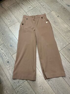 Woman’s SPANX camel pull on pants with gold buttons. Size Medium Petite.Like new